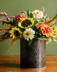 This Crock in the Graphite Glaze holds the last blooms of summer: sunflowers, dahlias and long, soft Bunny Tails. 