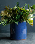 Deep leafy greens are placed artfully into the Ultramarine Crock.