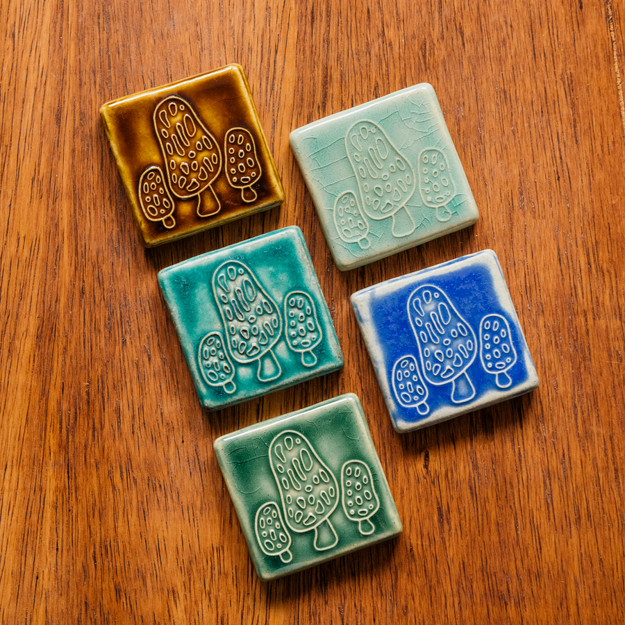 All four glaze types are represented in this image. Celadon, Pewabic Blue, Periwinkle, Molasses, and Emerald.