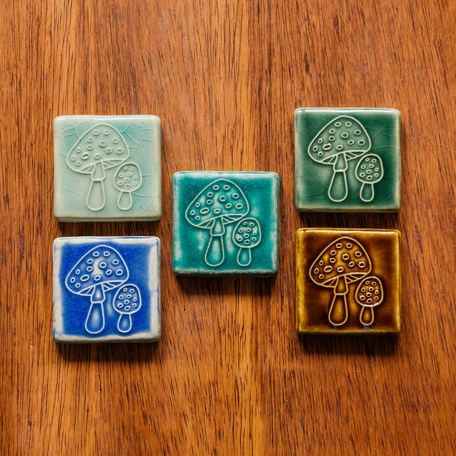 All four glaze types are represented in this image. Celadon, Pewabic Blue, Periwinkle, Molasses, and Emerald.