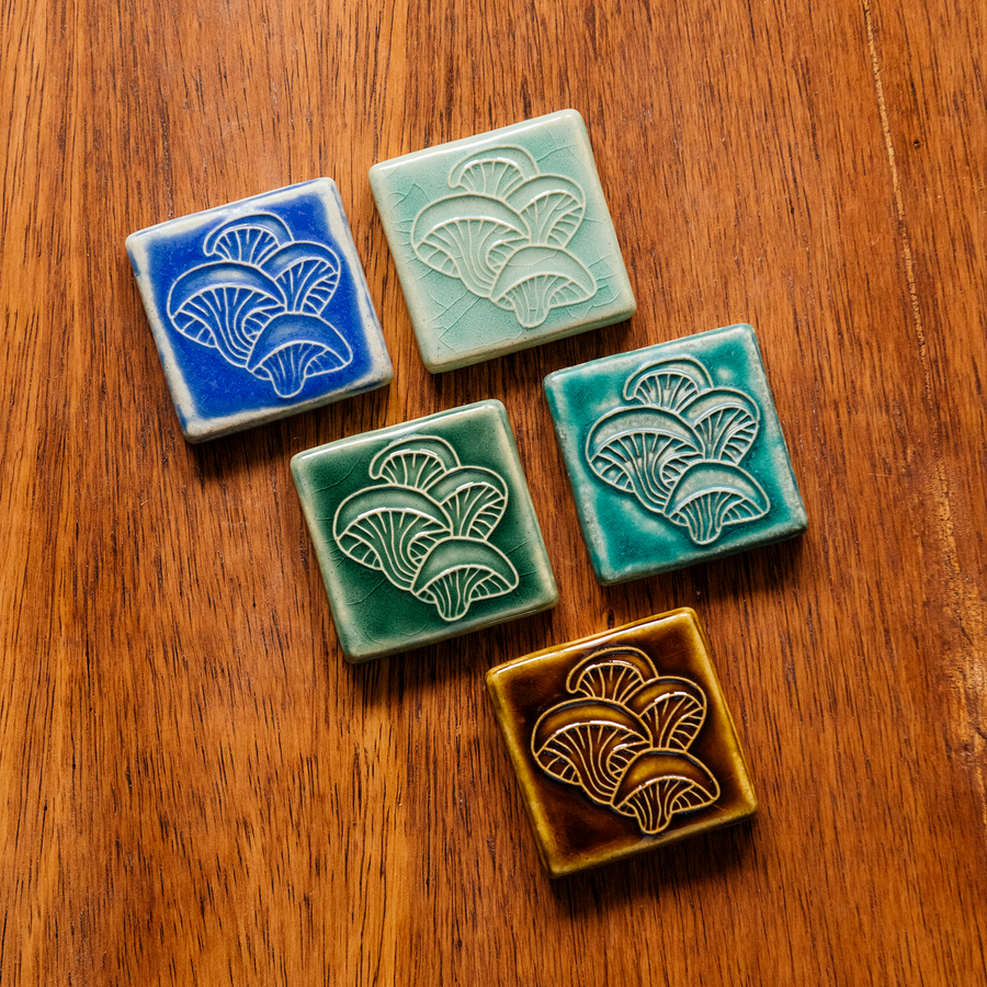 All four glaze types are represented in this image. Celadon, Pewabic Blue, Periwinkle, Molasses, and Emerald.