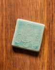 This tile features the glossy pale blue Celadon glaze.