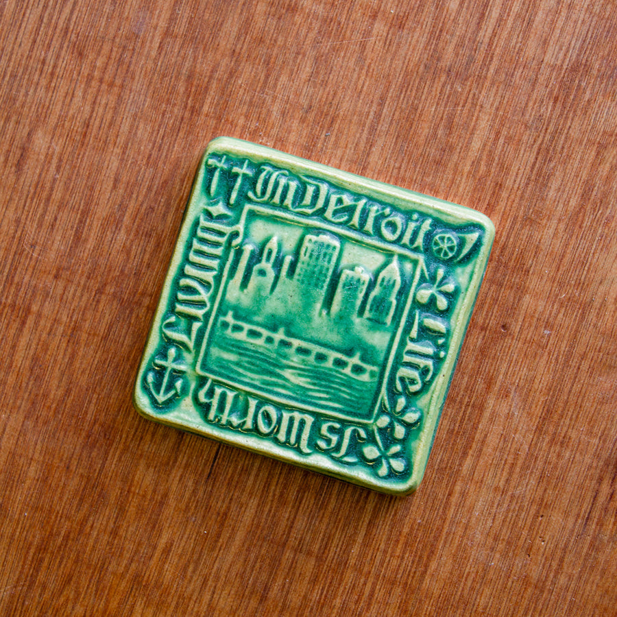 This tile features the matte blueish-green Pewabic Green glaze.