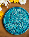 This trivet features the matte turquoise Pewabic Blue glaze.