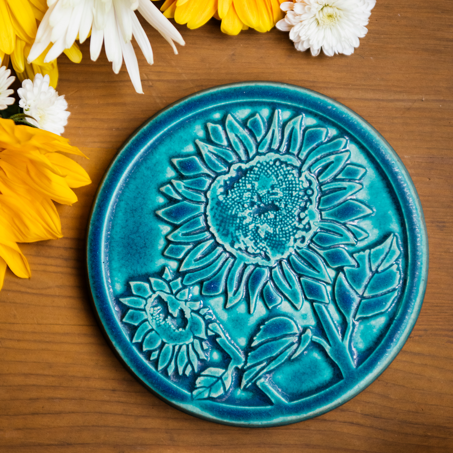 This trivet features the matte turquoise Pewabic Blue glaze.