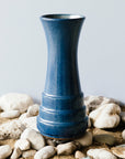 This Step Vase features the matte cornflower Leland Blue. This glaze can mix with the iron in the clay body to produce organic speckles of dark brown across the vase's surface.