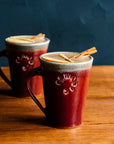 These mugs feature the glossy, deep red Winterberry glaze.